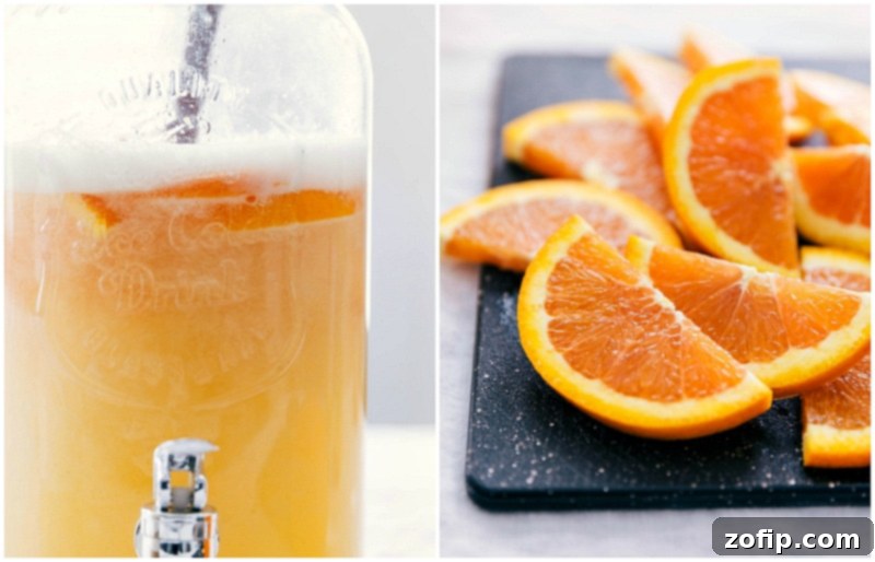 Beautifully sliced Cara Cara orange pieces being gently added to a large glass drink dispenser filled with the prepared white grape and citrus soda punch, enhancing both flavor and presentation.