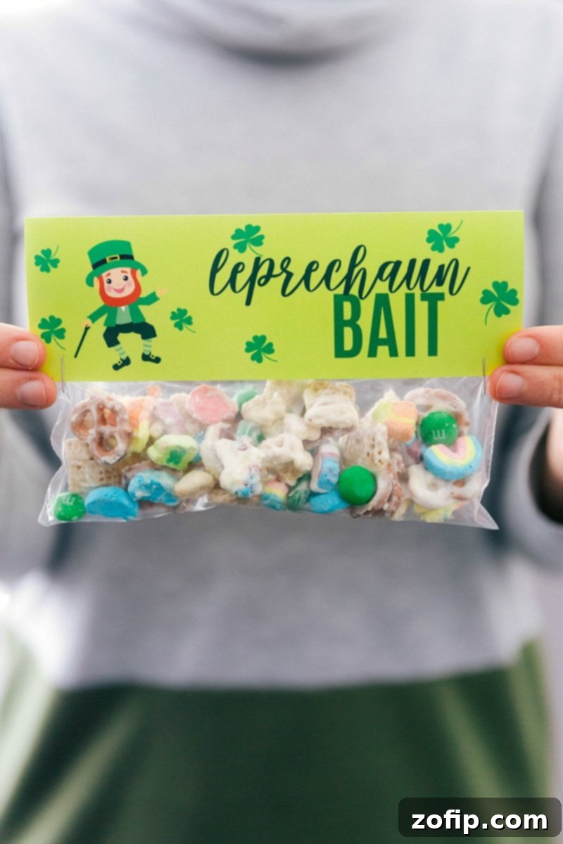 Delightful 'Leprechaun Bait' treats, ready for St. Patrick's Day gifting with a charming printable bag topper. A snack-sized plastic bag filled with Leprechaun Bait snack mix and topped with a 'Leprechaun Bait' printable