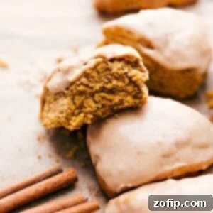 Pumpkin scones with a delectable bite missing.