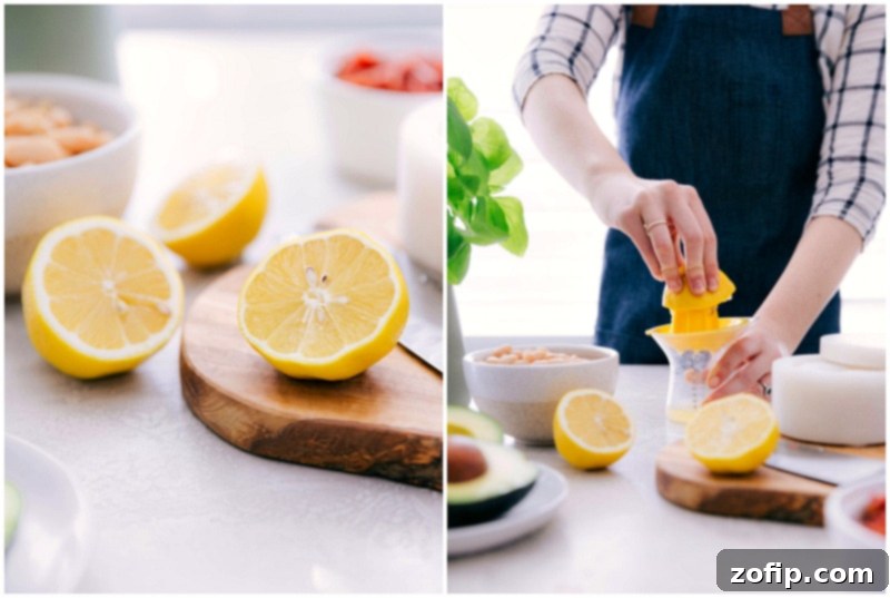 This White Bean Salsa with creamy avocado, crisp corn, savory sun-dried tomatoes, fresh lemon, and sweet basil is our latest obsession! It's perfect over grilled Pesto Chicken, quinoa, or couscous, or with some good tortilla chips. Recipe via Chelseasmessyapron #healthy #keto #whole #protein #whole30 #best #avocado #corn #sundriedtomatoes #clean #cleaneating #whitebean #salsa Fresh lemons being juiced over a bowl, illustrating a key step in making White Bean Salsa