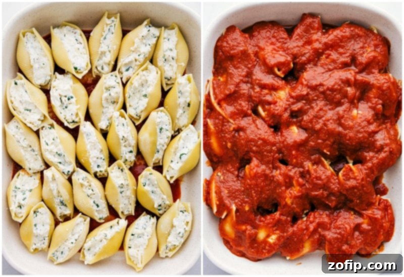 Layers of jumbo stuffed pasta shells generously covered in marinara sauce and cheese in a baking dish, ready for the oven.