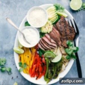 Steak Fajita Recipe in a skillet with tortillas and toppings.