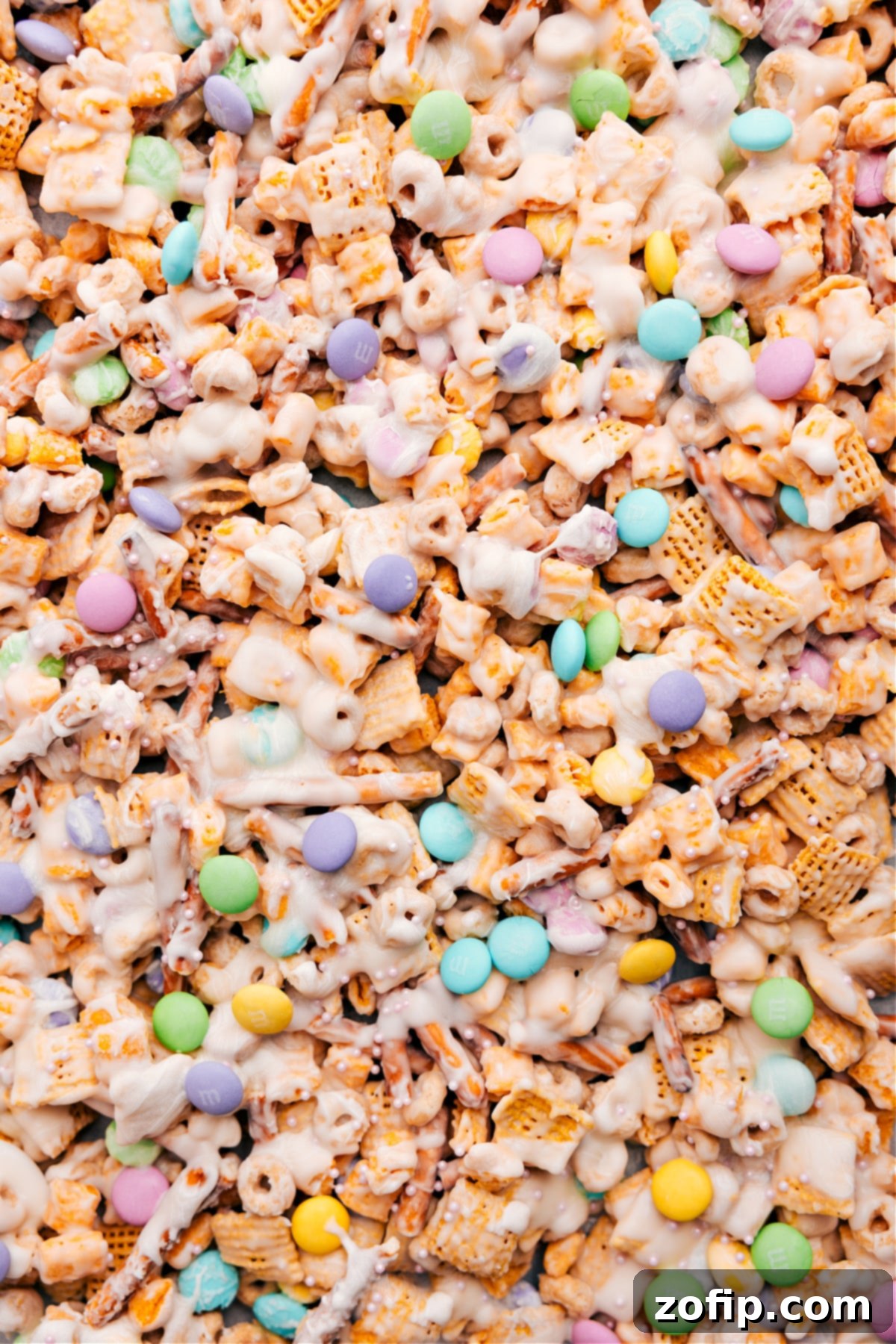 Bunny Bait recipe spread on the pan, topped with sprinkles and spring M&Ms.