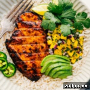 Mango Glazed Chicken 3 A beautifully presented serving of Mango Chicken with vibrant salsa, captured from above, ready to be enjoyed.