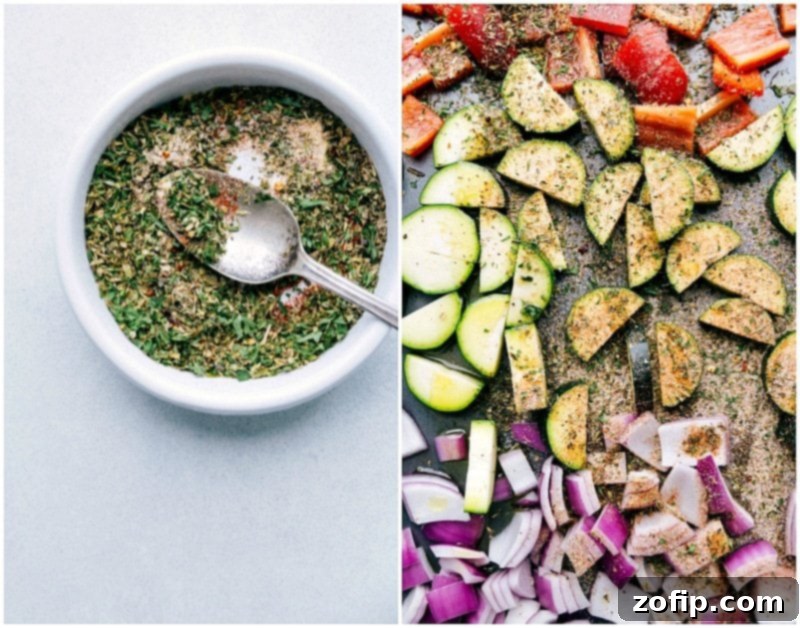 Close-up shot of a variety of raw, chopped vegetables and uncooked frozen gnocchi spread evenly on a large baking sheet, being generously sprinkled with a dry Italian seasoning mix.