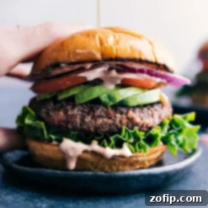 Zesty Black Bean Burger 3 Gorgeous finished black bean burger with fresh vegetables sandwiched between a beautiful buttered bun.