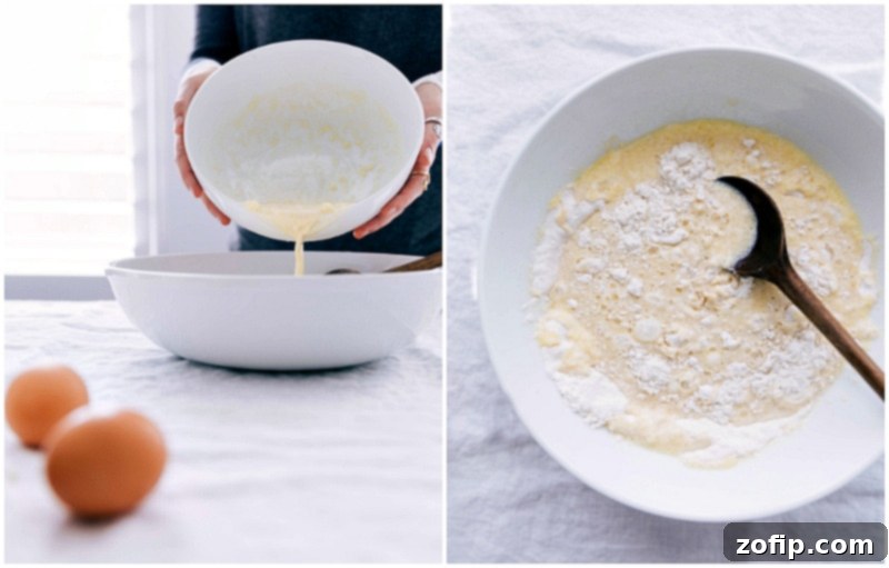 Adding Wet Ingredients to Dry for Pancakes Butter and wet ingredients being added to the dry ingredients in a mixing bowl for the recipe.