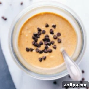 Pumpkin overnight oats topped with chocolate chips, prepared and ready for on-the-go enjoyment.