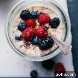Berry overnight oats, healthy and ready for on-the-go consumption, topped with an assortment of fresh berries.