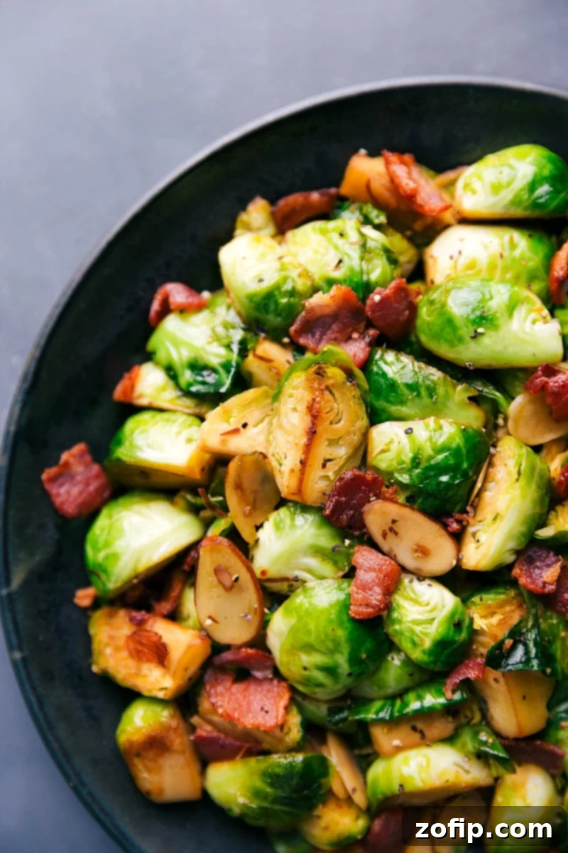 A serving of flavor-packed Brussels sprouts and bacon, beautifully plated and ready to be enjoyed.