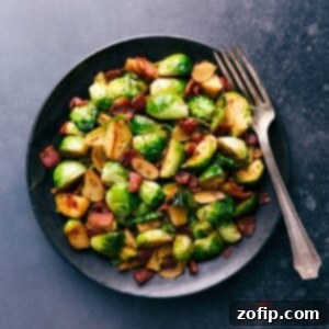 Brussels sprouts and bacon on a plate, cooked to perfection and ready to be enjoyed.