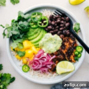 Homemade Chicken Rice Bowl Perfection 3 The finished Chicken Rice Bowl with tender chicken, avocado sauce, and fresh toppings.