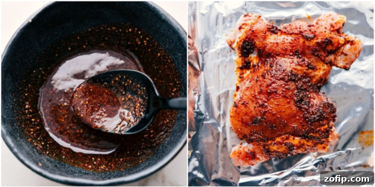 The Best Chicken Thigh Marinade For Chicken Rice Bowls Balsamic-herb seasoning being applied to boneless, skinless chicken thighs, preparing them for the oven and ensuring maximum flavor absorption.