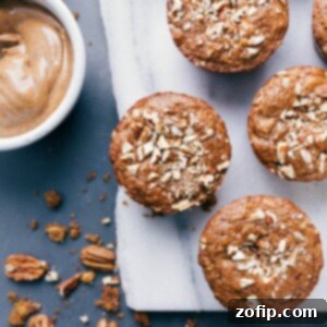 A single, perfectly baked gluten-free apple muffin, golden and inviting, ready to be enjoyed as a healthy breakfast or snack.