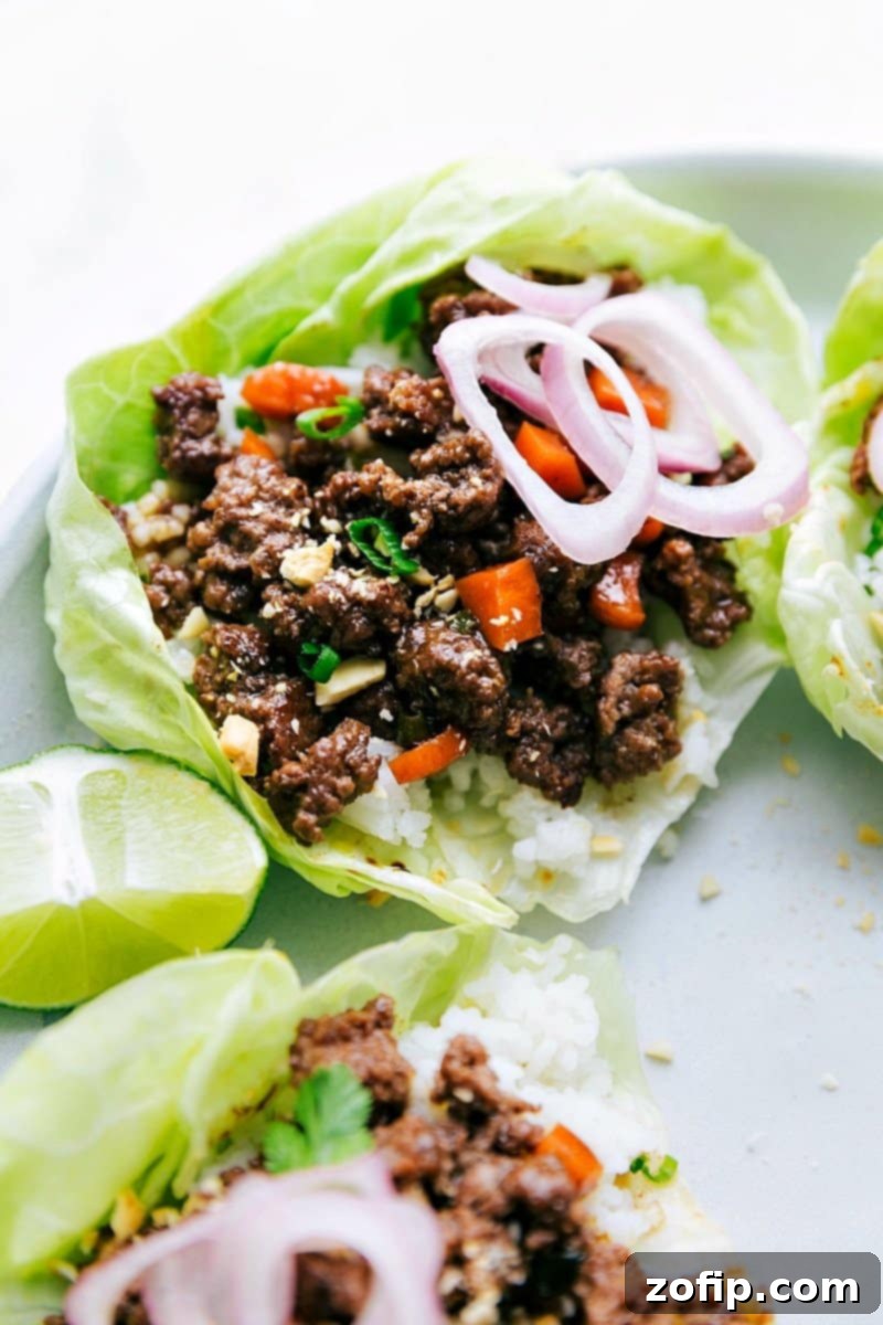 The finished beef lettuce wraps, beautifully presented with fresh toppings and packed with delicious, savory flavor.