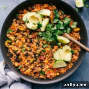 One-skillet sweet potato burrito bowl loaded with toppings, served in the skillet.