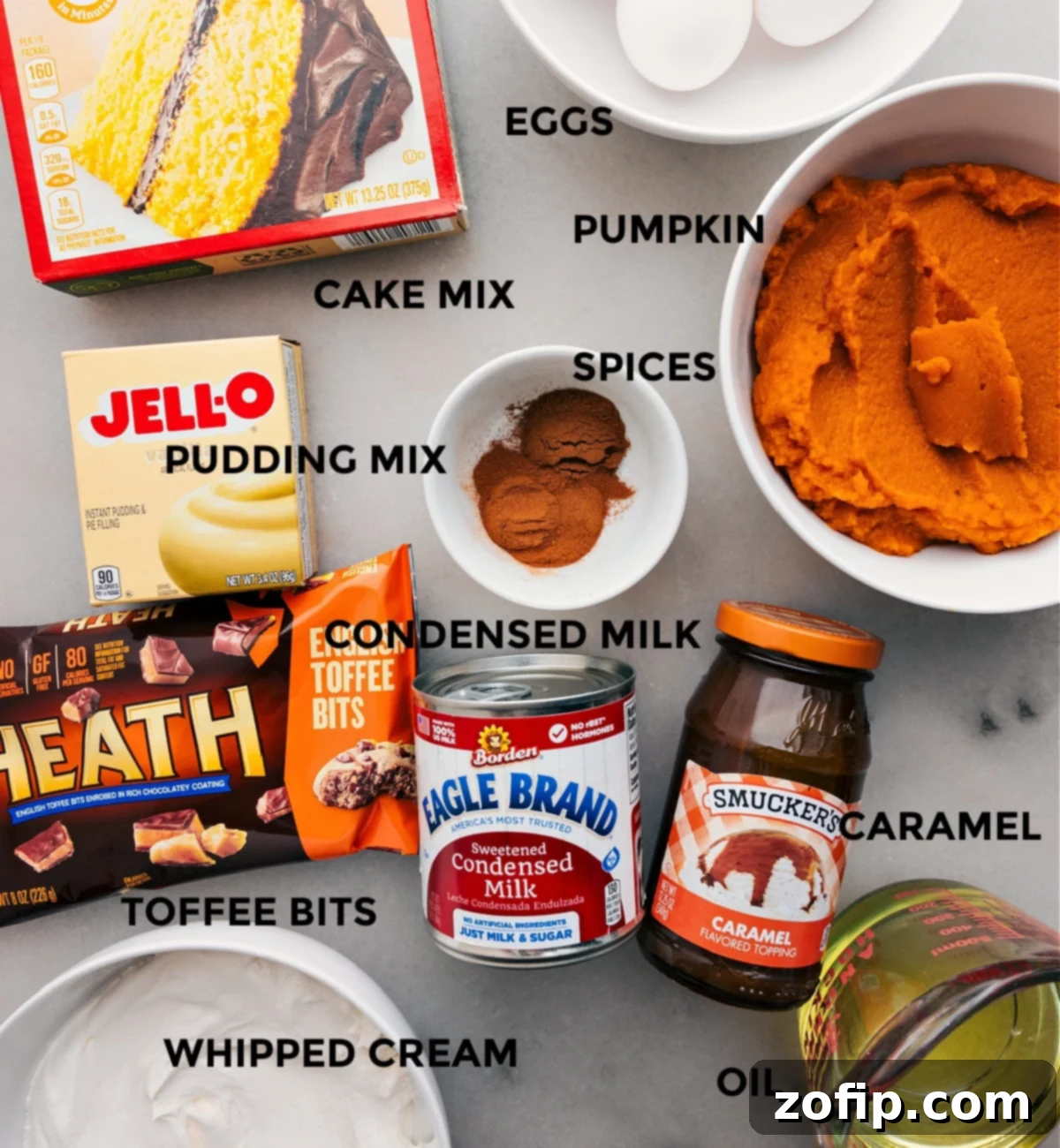 Essential Ingredients for a Perfect Pumpkin Poke Cake An array of fresh, high-quality ingredients for Pumpkin Poke Cake, neatly prepped and ready for assembly, laid out on a clean surface.