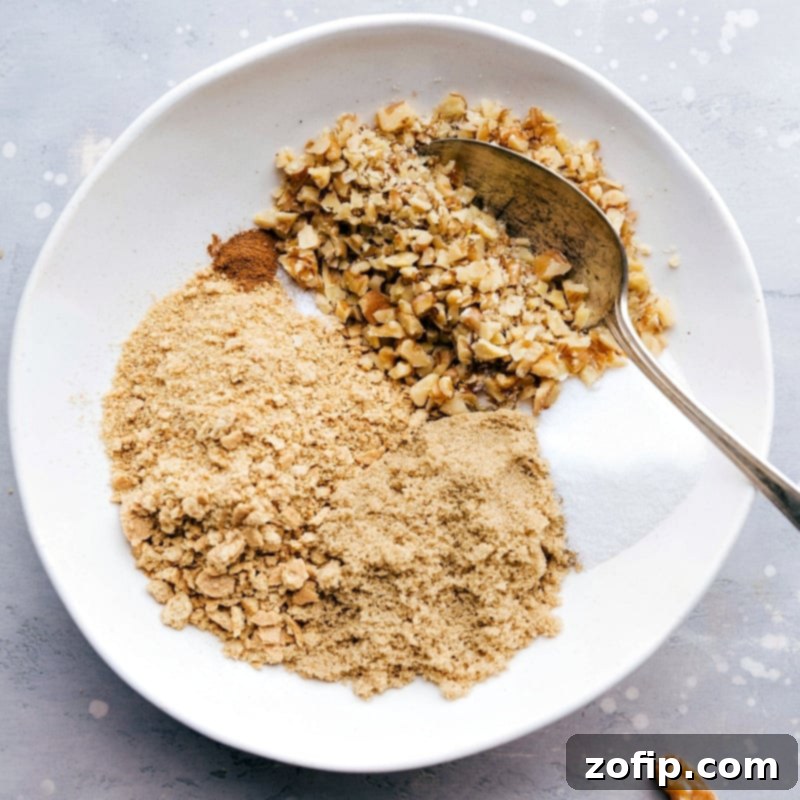 Caramelized Pineapple Slices 2 Preparing the brown sugar and walnut topping, a mouthwatering addition to the dessert, adding a sweet and crunchy finish.
