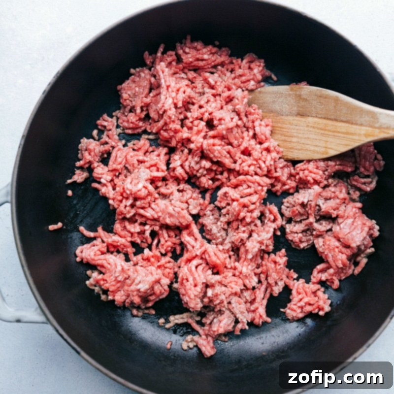 Cooking Ground Beef for Taco Lettuce Wraps - Preparing the Filling Ground beef being cooked on a skillet, a crucial step in this recipe.