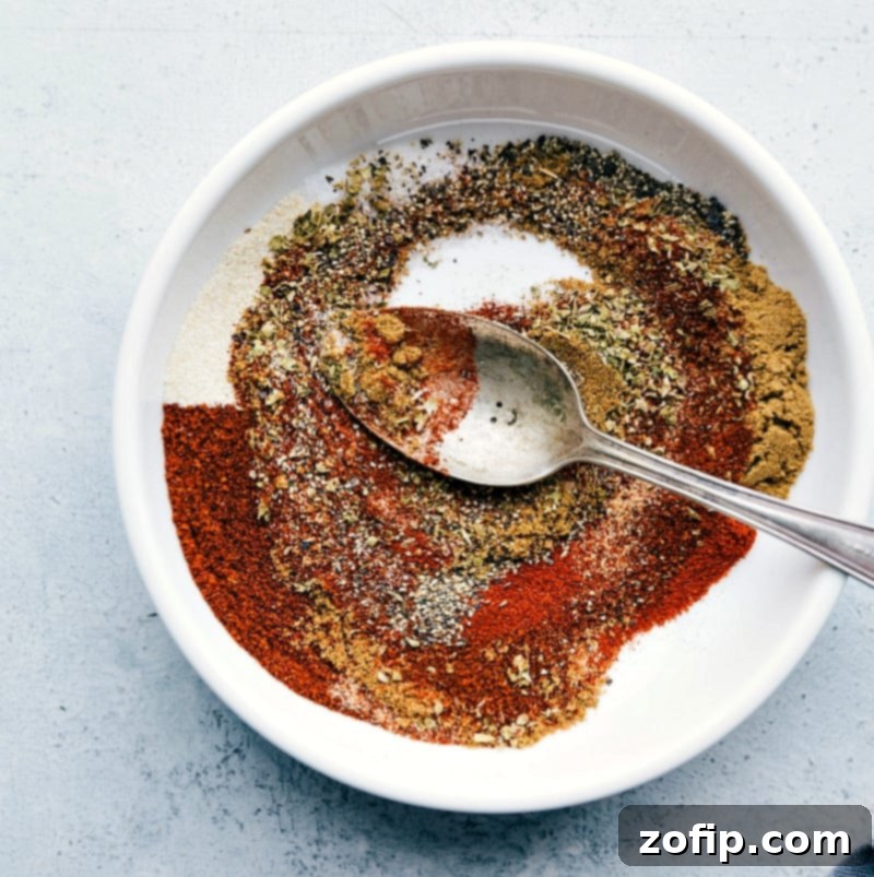 Mixing Seasonings for Taco Lettuce Wrap Recipe - Creating a Flavorful Blend All the seasonings in a bowl, ready to be mixed together to add rich flavor to the recipe.