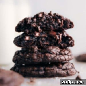 Stack of rich, fudgy chocolate cookies with sea salt, ready to be enjoyed.