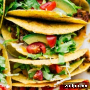 Savory Ground Beef Tacos 2 Delicious savory beef tacos in a casserole dish, fully assembled with all the toppings.