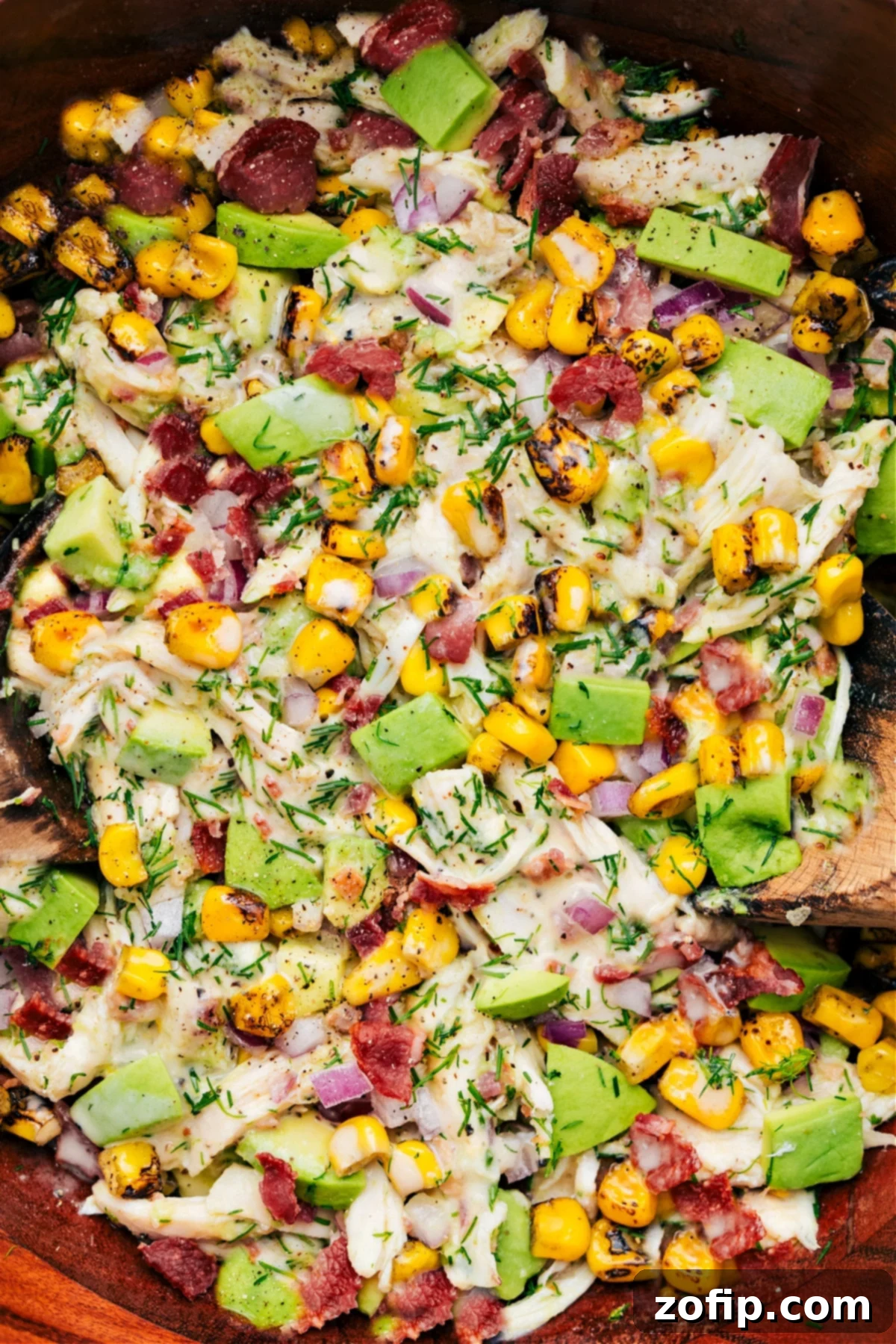 Avocado Chicken Salad in a beautiful bowl, perfectly dressed and tossed, ready to be served and savored.
