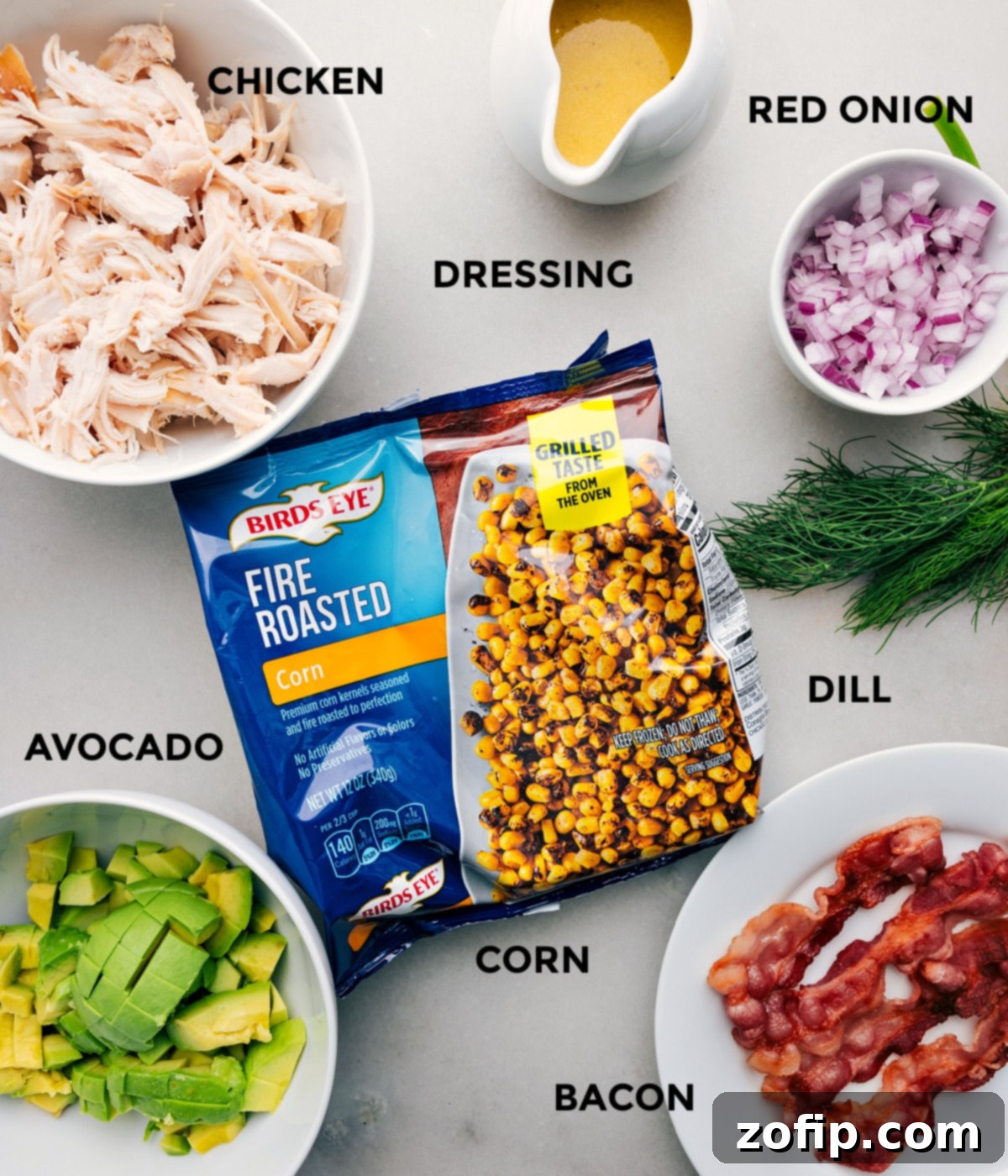 All the fresh ingredients for this avocado chicken salad recipe, meticulously prepped and laid out for easy assembly.
