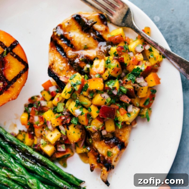Grilled Chicken with Peach Salsa and Green Beans - A Tasty and Colorful Dish Delicious grilled chicken topped with peach salsa, served with green beans on the side.