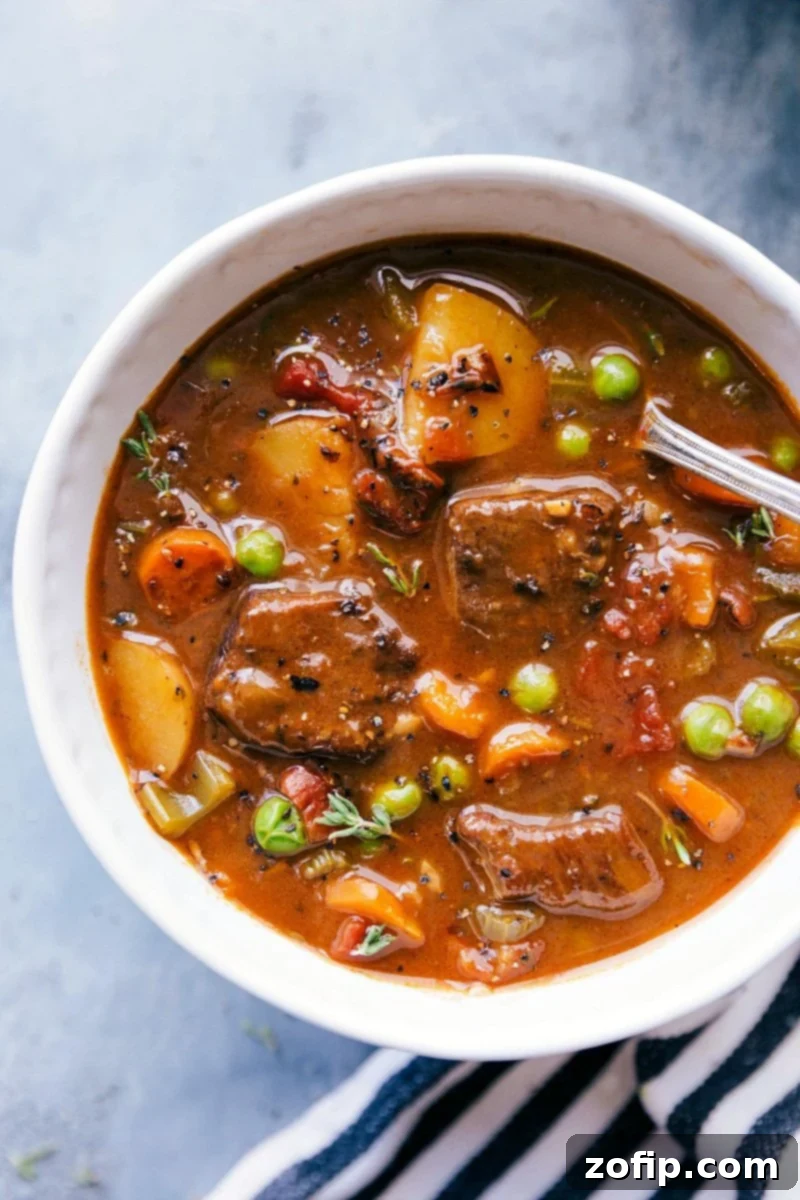 A warm and hearty bowl of Instant Pot beef stew, rich with tender beef, colorful vegetables, and a thick gravy, ready to be served and savored.