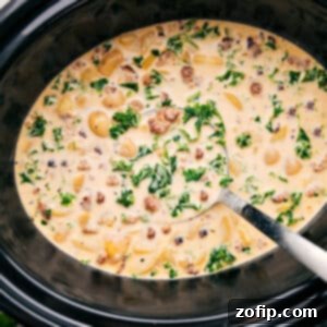 A hearty bowl of Slow Cooker Zuppa Toscana Soup.