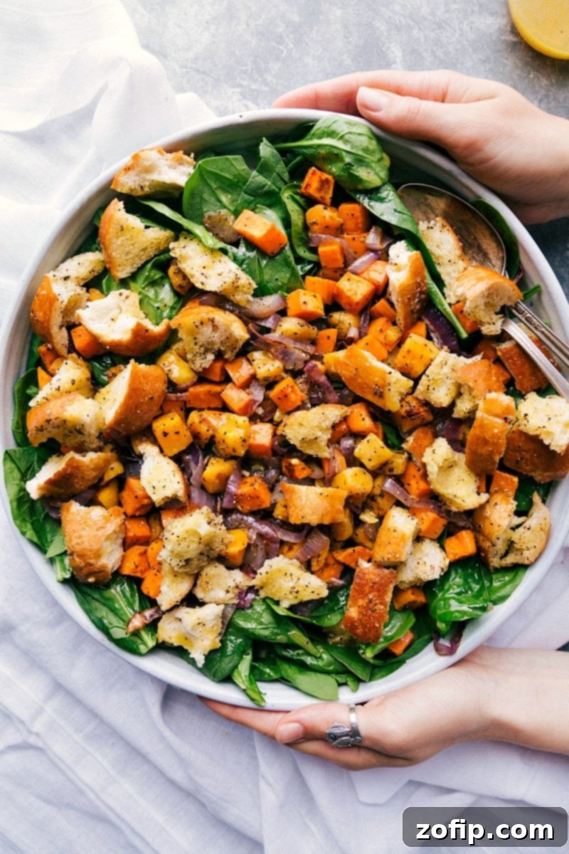 Hearty Roasted Veggie Salad in a Giant Bowl, Perfect for Fall Gatherings A vibrant, delicious, and filling roasted veggie salad in a large serving bowl, ready to be enjoyed.