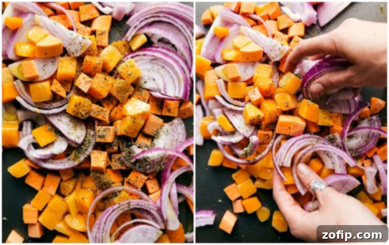 Seasoned Chopped Vegetables on a Sheet Pan, Prepped for Roasting Assortment of freshly chopped vegetables, including sweet potatoes, squash, and red onions, seasoned on a sheet pan, ready for roasting.