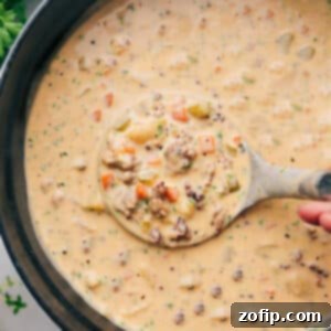 A close-up of a bowl of creamy Sausage Potato Soup, highlighting the rich texture, tender potatoes, and savory sausage, ready to be served.