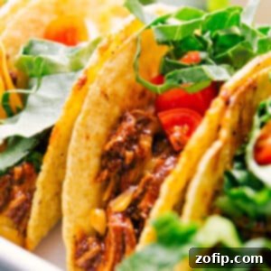 Irresistible Rotisserie Chicken Tacos 2 A freshly prepared rotisserie chicken taco with vibrant toppings