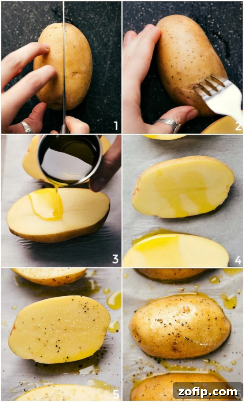 Perfect Fluffy Baked Potatoes 2 Halved potatoes being prepared for baking with fork piercings, an oil rub, and a seasoning of salt and pepper, positioned cut-side-down on a baking pan.