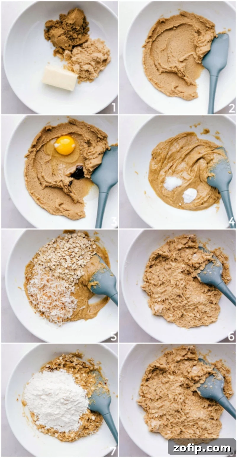 Crafting the Perfect Cookie Dough: Blending Key Ingredients for Delicious Oatmeal Cranberry Cookies High-angle shot of ingredients being combined and mixed into dough in a large bowl, creating a well-mixed batter for cranberry oatmeal cookies.