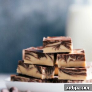 Velvet Tiger Swirl Fudge 3 Stacked slices of tiger butter fudge with distinctive chocolate and peanut butter swirls.