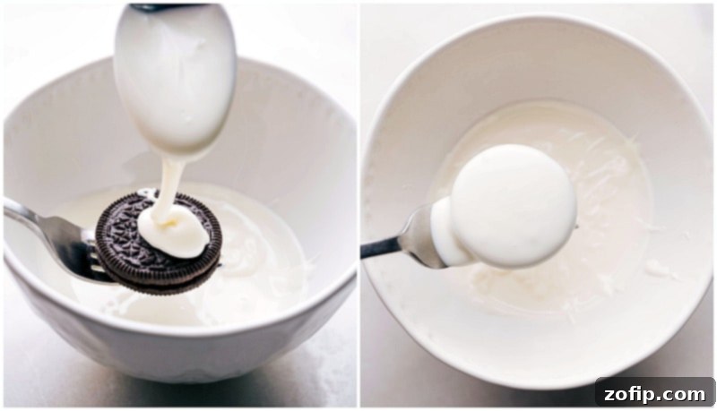 Decadent Chocolate Dipped Oreos 7 Process shot demonstrating an Oreo cookie being skillfully dipped and fully covered in rich melted chocolate using a simple fork, with excess chocolate dripping off