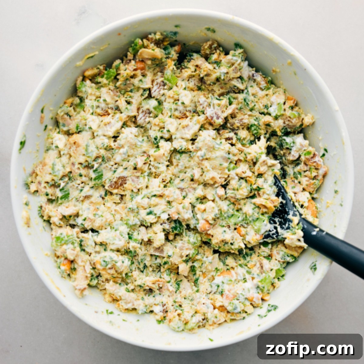 The finished Curry Chicken Salad mixed together and ready to be served in various ways – as lettuce wraps, on bread, or enjoyed directly from the bowl.