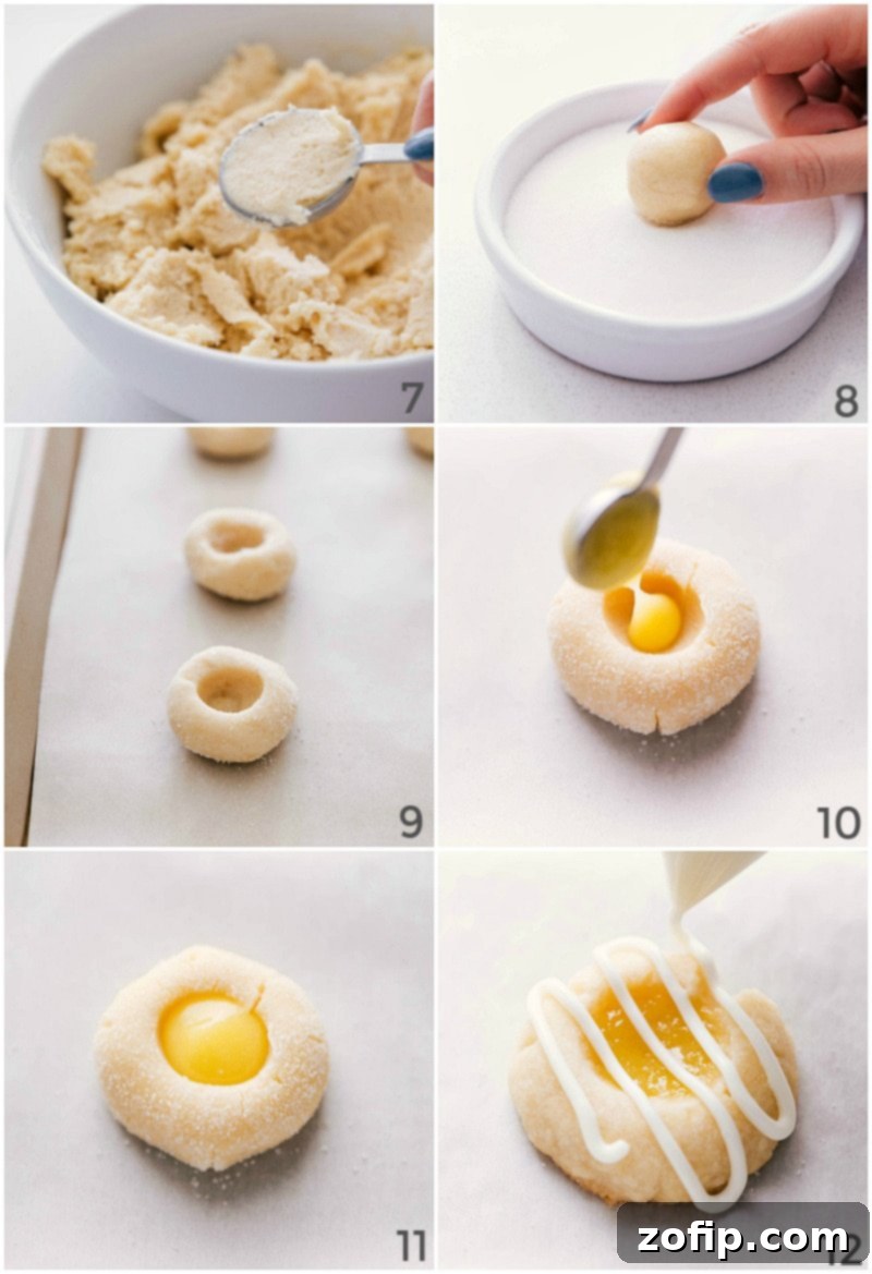 Lemon curd cookies fresh from the oven, being drizzled with a smooth white glaze.