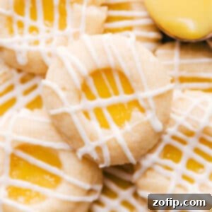 A close-up of a stack of Lemon Curd Cookies with a smooth glaze.