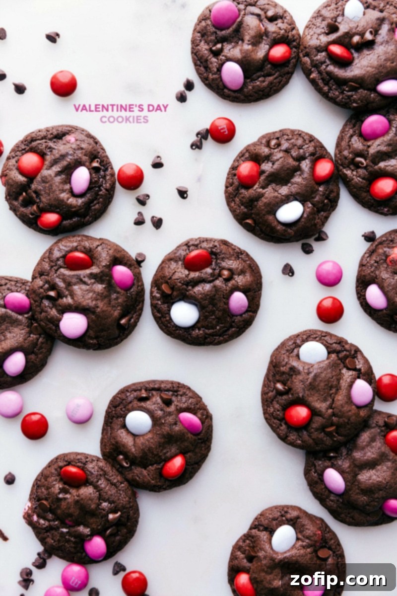 Delicious Valentine Cookies Ready to Savor Baked Valentine cookies, adorned with colorful M&M's, ready to be enjoyed.