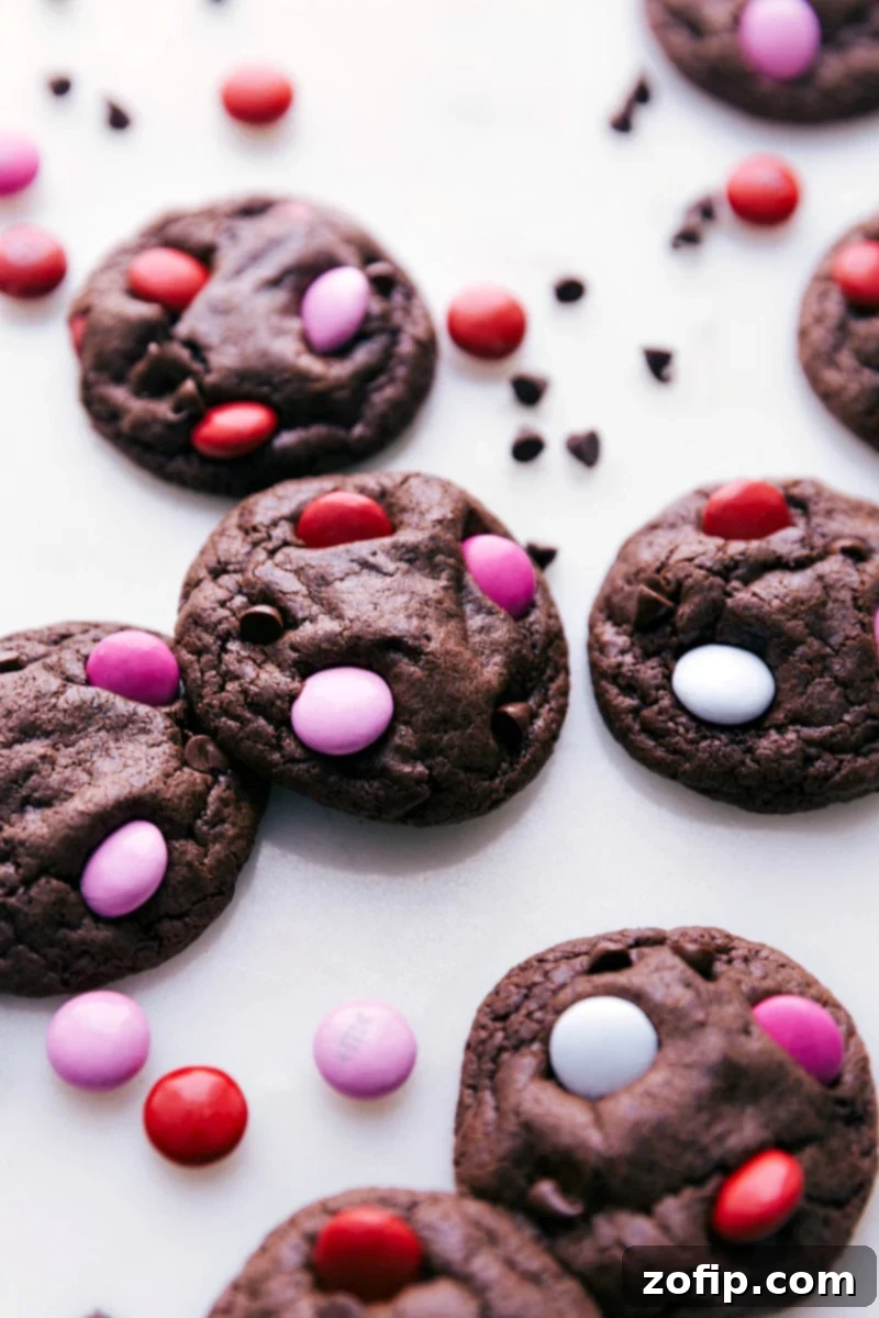 Valentine's Cookies Decorated with Festive M&M's Freshly baked chocolate cookies adorned with colorful Valentine's M&M's, arranged beautifully.