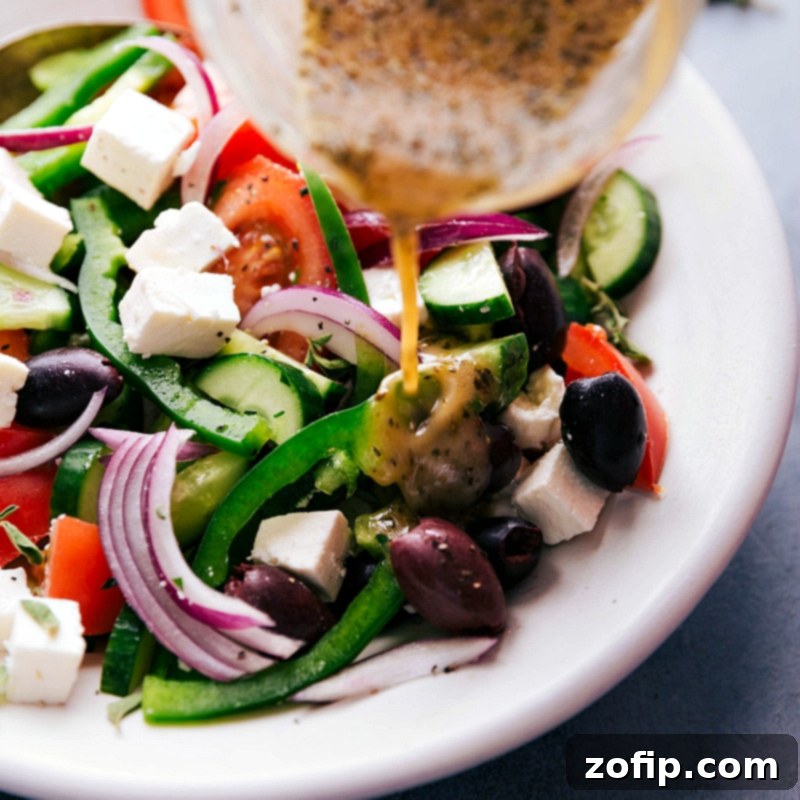 Dressing being poured over finished dish.