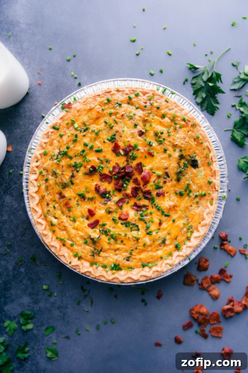 Image of the baked Broccoli Cheddar Quiche, perfectly golden and ready to be sliced and served.