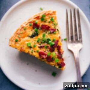 A top-down view of a freshly baked Broccoli Cheddar Quiche with a perfect golden crust.