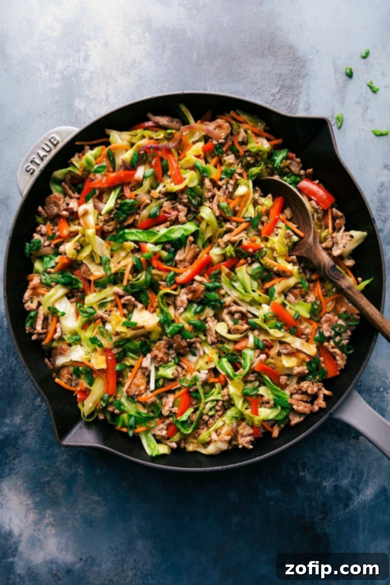 A beautifully plated Egg Roll in a Bowl, showcasing a vibrant mix of ingredients and a savory sauce, ready to be enjoyed.