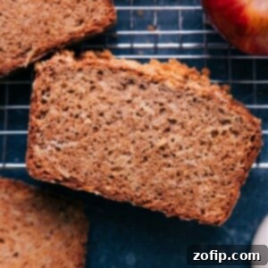 A delicious slice of apple bread, showing its moist and tender crumb.