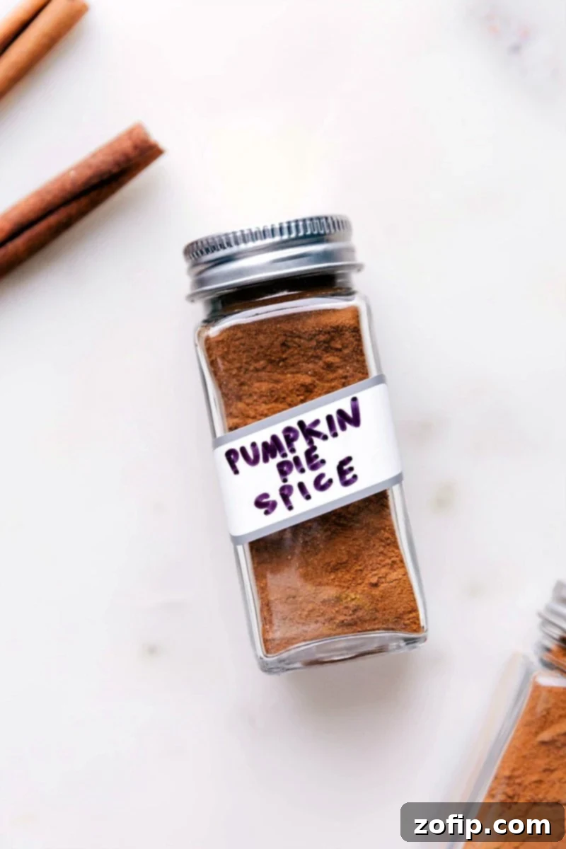Container of aromatic pumpkin pie spice, a perfect addition to fall recipes.